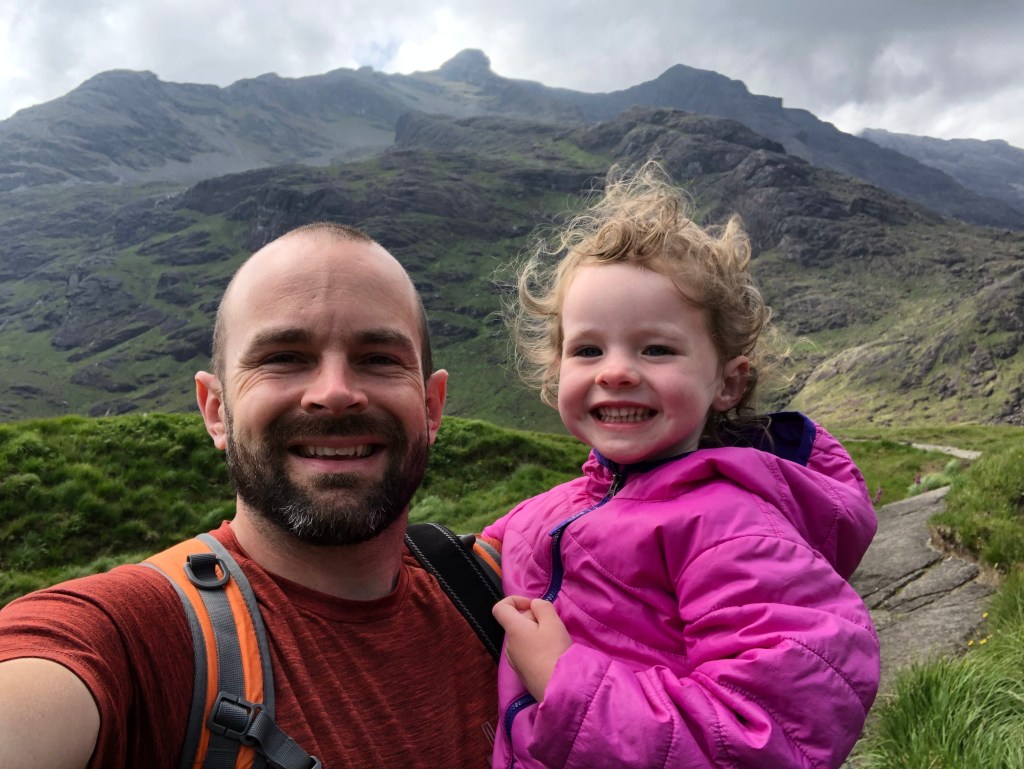 man and girl in mountain landscape